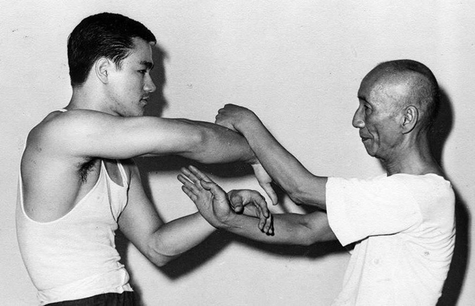 Grandmaster Ip Man with his student Bruce Lee practicing Wing Chun during the 1960s