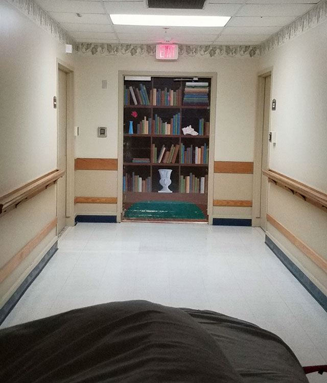 Exit Door disguised as bookcase in Alzheimers Ward