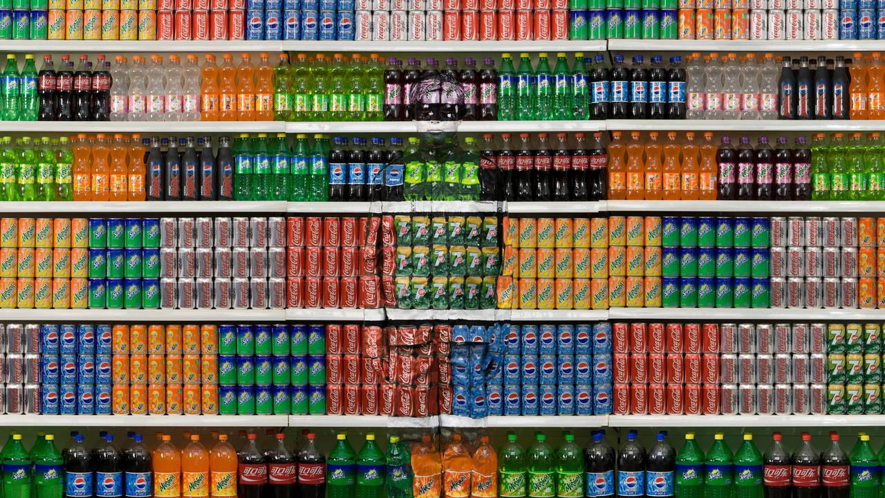 Artist Liu Bolin “The Invisible Man” has his Body painted to blend in with his Background