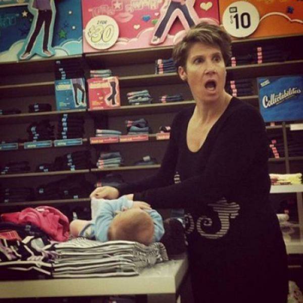 woman changing diaper in old navy - Ro Collectabilite