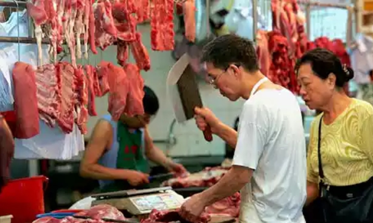 A man butchering beef in China