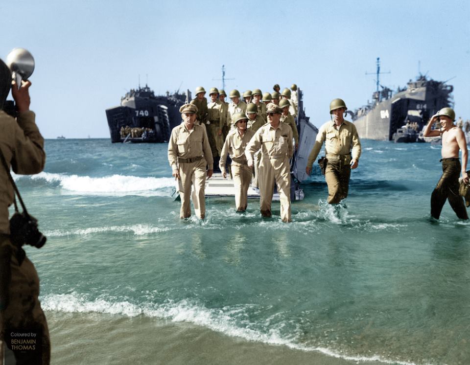 General Douglas MacArthur with General Richard Sutherland (left) and Colonel Lloyd Lehrbas (far left) wading ashore at ‘Blue Beach’, Dagupan, on the island of Luzon, following the landing of the US 6th Army in the Lingayen Gulf, Philippines, 9 January 1945.

The Battle for Lingayen Gulf had commenced three days earlier on the 6 January, with a ferocious Allied bombardment of suspected Japanese positions along the coast by ships from the US Navy and Royal Australian Navy.
Troops quickly secured the coastline following the landing, pushing several miles inland over the following days. Lingayen Gulf would become a major supply depot for Allied forces for the remainder of the Pacific campaign.