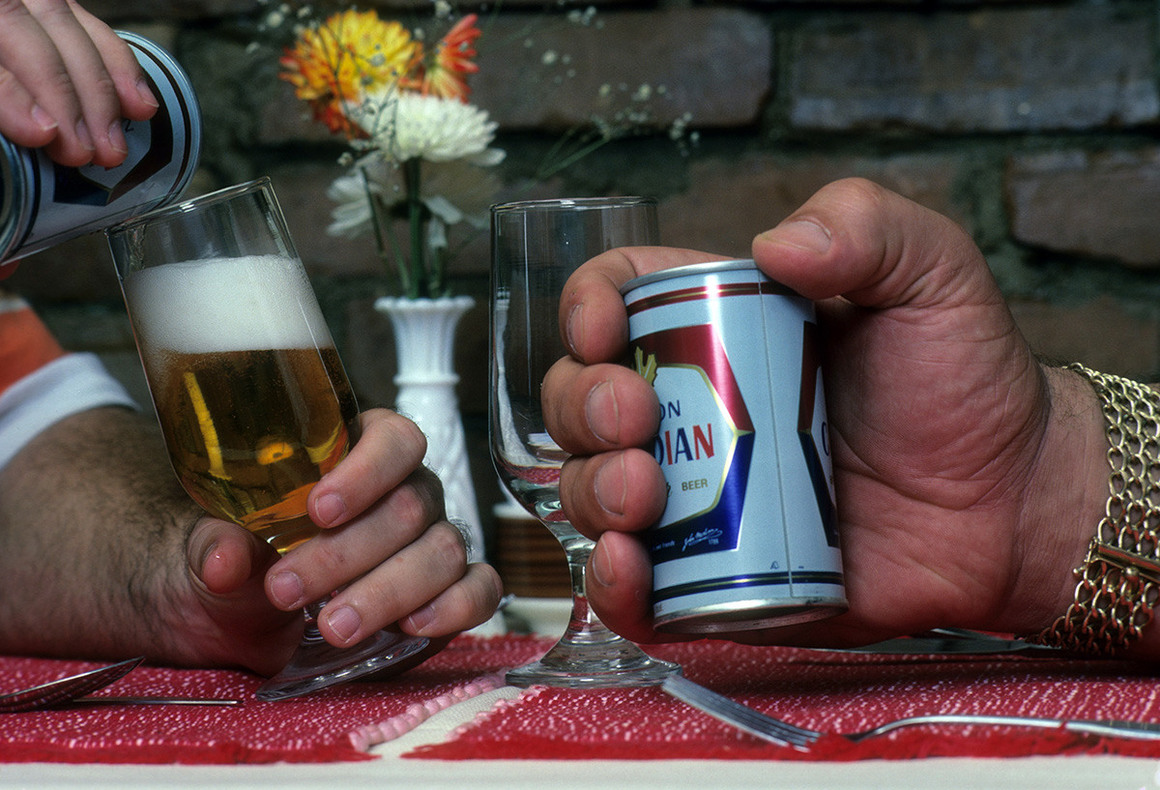 Andre the Giant holding a beer can