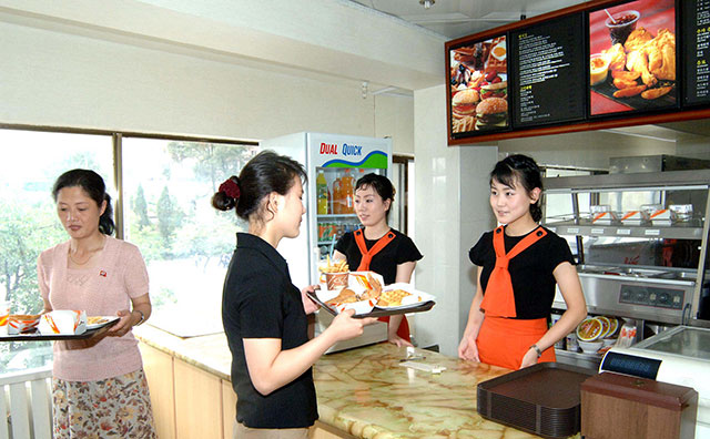 North Korean Fast Food.

All of its burgers, whether made of minced beef, fish or vegetables, come with lashings of kimchi
Minced beef and bread costs $1.70 , roughly the same price as a McDonald’s cheeseburger in the UK but almost half the daily income of an average North Korean. The average wage in North Korea last year was just under $1000