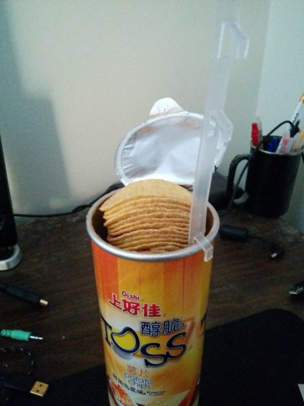 No longer is it impossible to reach those hard-to-get ‘Pringles’ with this handy tab to lift the chips up for you.