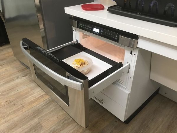 A microwave that has a built-in pull out drawer for easy retrieval. Now if they used this same technology for ovens it might just cut down on the numerous 3rd degree burns I suffer while pulling out foods with a bit too much confidence.