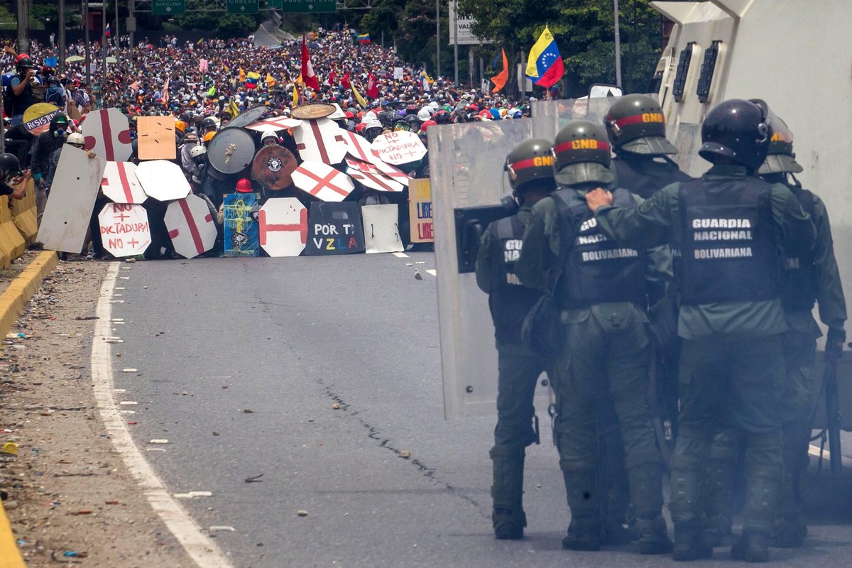 Protesters with self-made shields face National Guard in Venezuela