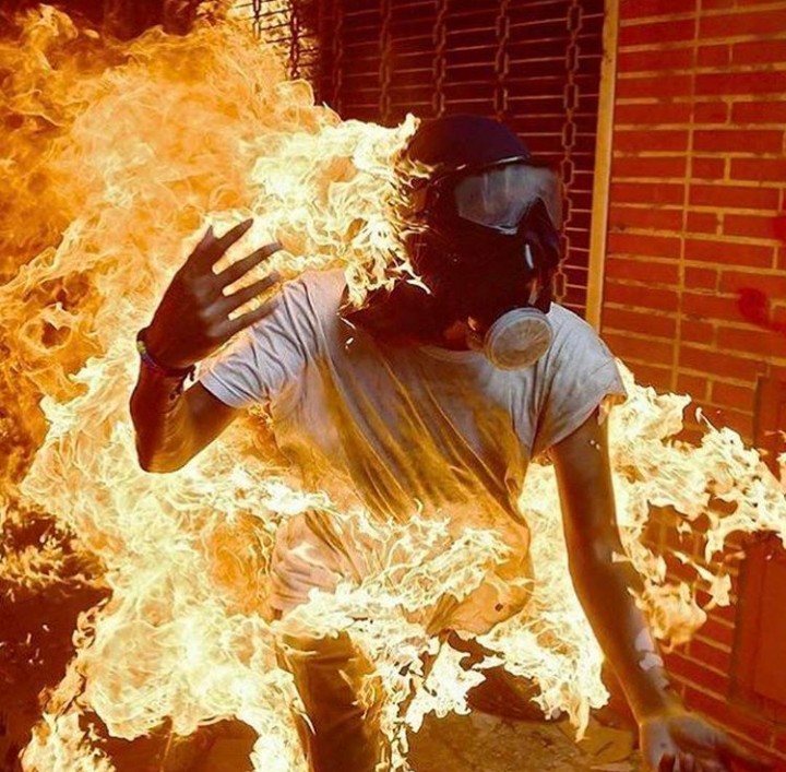 Picture taken the exact moment when a Venezuela protester was burning alive