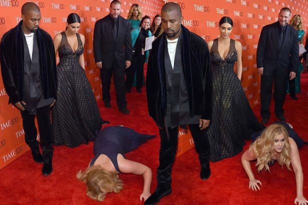 Amy Schumer tries to “prank” Kanye West by diving in front of him and pretending to pass out, Kanye reacts by walking away