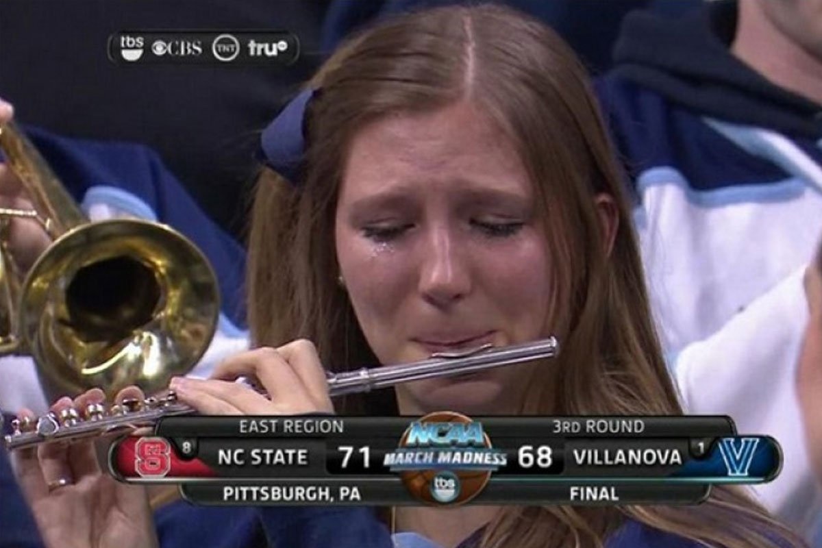 Roxanne Chalifoux.
Roxanne was more than a member of the band. She was actually a huge fan of the Villanova basketball team. When they were eliminated from the NCAA tourney she cried as the band played their final tune of the season. Someone caught a picture of her and "Crying Piccolo Girl" was born.