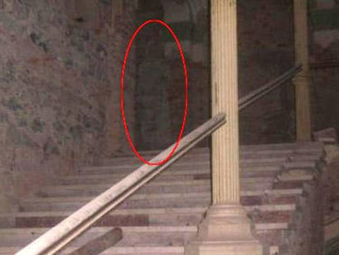 The ghost of a woman in white has been haunting a Romanian hotel for the past 150 years.
The Decebal Hotel has been around for a while, so it was bound to accrue one or two disgruntled customers over the years. This ghost of a tall woman in a long white frock is believed to haunt the spa area. But it wasn't until 2008 that 33-year-old Victoria Iovan got photographic proof of the ghost.