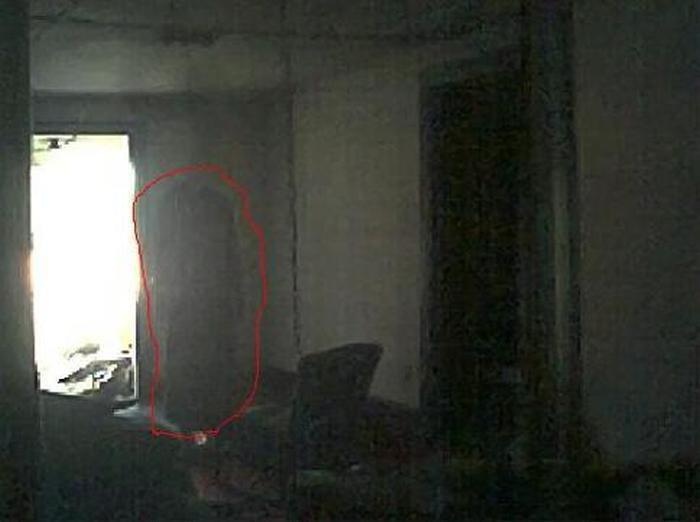Remember the movie "The Woman In Black"? Well, this might be the real McCoy.
It was taken at a famous haunted house that's over 180 years old in Antioch, TN. You can clearly see that this ghost is wearing an old style black dress, and it isn't camera shy, but you should be ghost shy and get the hell out of there.