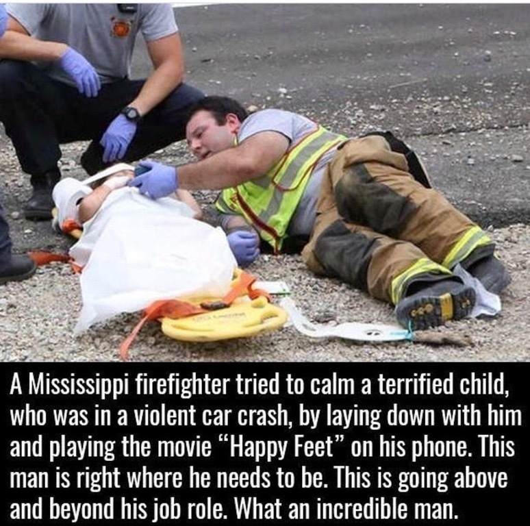 A terrified child was having a difficult time calming down after a violent car crash.
To help calm him down, a firefighter laid on the ground beside him and played the movie "Happy Feet" on his phone.