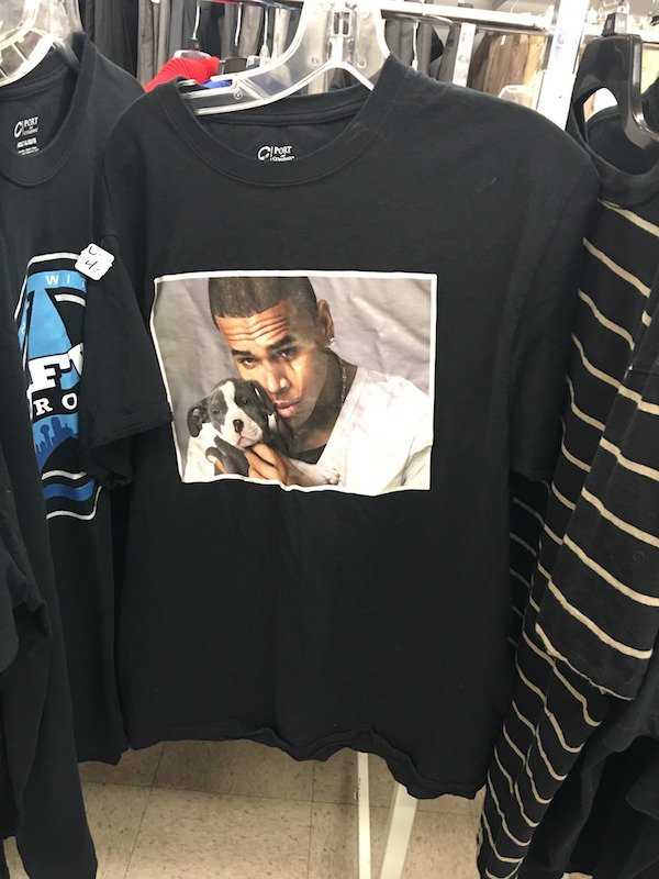T-shirt with a picture of Michael Vick cuddleing with a puppy.