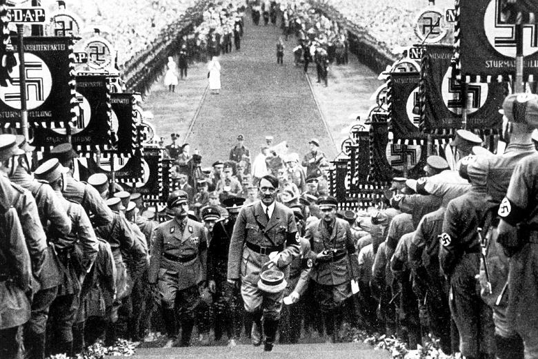 Hitler mounts the steps to the podium from where he will make his speech at the Nuremberg Rally, 1938