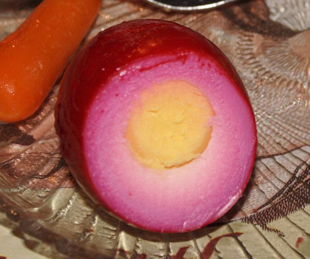 Pickled Egg.
Just a hard-boiled egg preserved in brine or vinegar. Most of the time eggs are left to marinate for months before serving.
