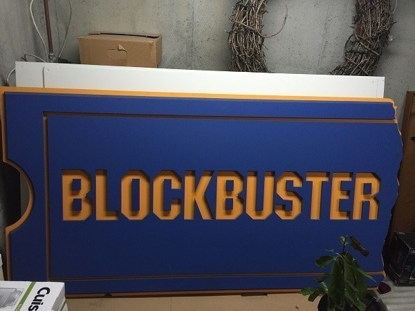 An abandoned home was purchased.
Once inside, this big and old Blockbuster wooden sign was discovered.