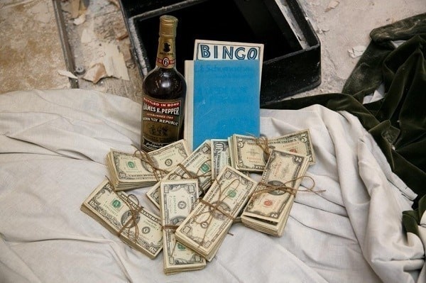 During the reno of a kitchen a safe hidden in the floor was found.
The contents included $50,000 cash, a Bingo card, a rare bottle of bourbon, and a book titled "A Guide for the Perplexed."