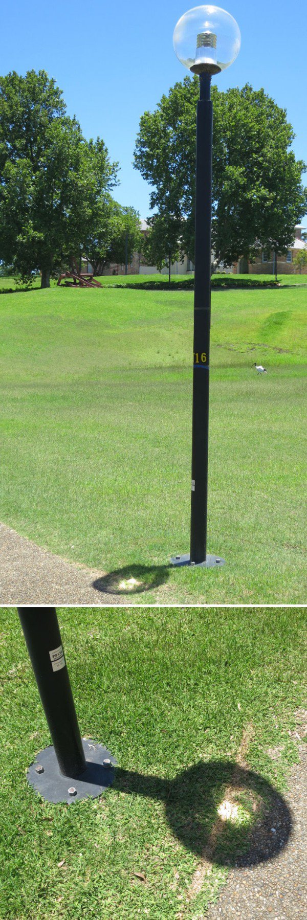 Spherical shaped street lamp that causes a small magnified point on the ground from the sun, which has etched a line in the ground