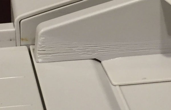 Copy machine that is scratched from so many repetitive movements.