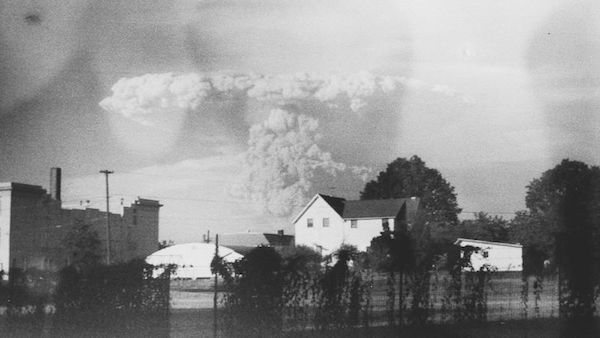 A vintage camera found at a Portland, Oregon thrift store containing a roll of undeveloped film has yielded an extraordinary set of images showing the 1980 eruption of Mount St. Helens, considered among the most destructive volcanic eruptions in US history. (Nearly 60 people were killed in the explosion, which caused about $1.1 billion in property damage.) 

On May 26th, 2017, photographer Kati Dimoff found a 1938 Argus C2 camera with a damaged roll of Kodachrome slide film inside. She took it to Blue Moon, a company that specializes in processing discontinued film, and was shocked to find that some of the shots showed Mount St. Helens erupting off in the distance. 

The camera also included a shot of a family in a backyard. The photo was published in the Oregonian newspaper, which attracted the attention of Mel Purvis. He's in the picture, as is his wife Karen, his late grandmother Faye, and his son, Tristan. The camera belonged to his grandmother, and Dimoff has returned it to the family.