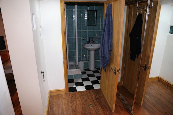 The area in the lower level has a normal shower, bathroom