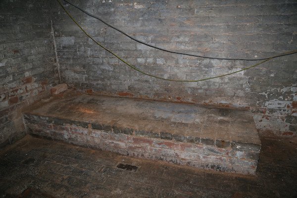 Some kind of tomb looking area in the room under his house.