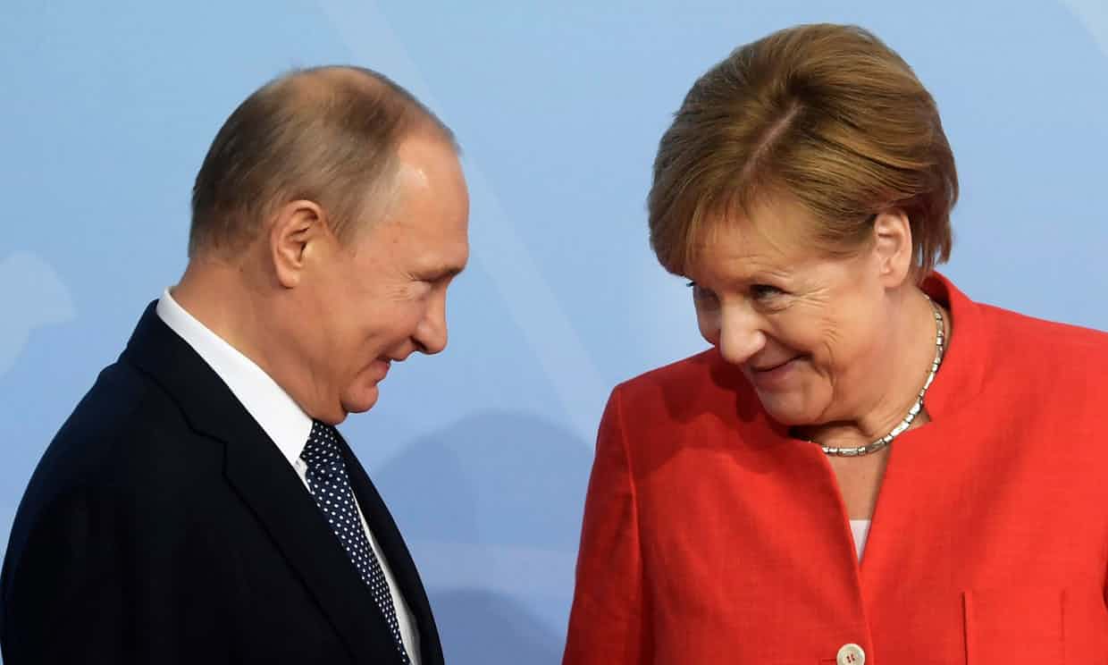 Putin and Merkel greeting at G20 Summit