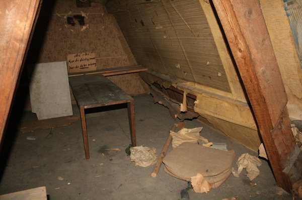 Redditor mYNDIG posted photos of a hidden room in the attic of his house in Norway, believed to have been untouched since World War II. He explained, "Our landlord told us that there might be a hidden room there, and what else to do when you should study for exams than actually go and look? I have a feeling he had already found it and only told us to make us look for it. But either way, finding it was the best prize.”

The secret doorway which was found when one of the roommates leaned on a fake wall, led to a room containing a table, an alarm, and a map showing Britain and northern France on the walls. A note written in Norwegian warns: "If you have a bad stomach, you do not have access." (In other words, there's no toilet up here.)

In a follow-up post, mYNDIG says the room had been known about by some local historians, one of which told them it "was used for pressing newspapers during the occupation, and they got most of their information from the BBC radio channel. They operated here in our attic from late December 1944 until Mars 1945; then they had to move after several investigations from (the) Gestapo, who never managed to find the room. We found some writings on the wall which turned out to be different places in Poland; they were following the Soviets march into Germany. One of the guys behind the newspaper, Åge Thorvaldsen, was eventually captured by (the) Gestapo and held captive in Grini until the end of the war."