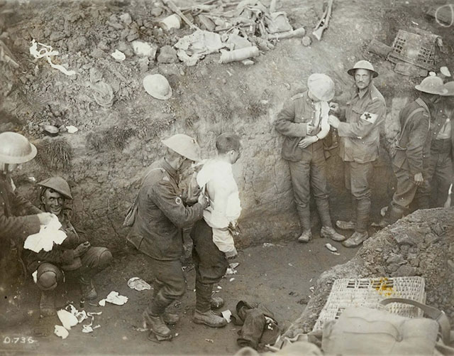 Shell shocked soldier (bottom left) in a trench during the Battle of Flers-Courcelette during the Somme Offensive. 1916