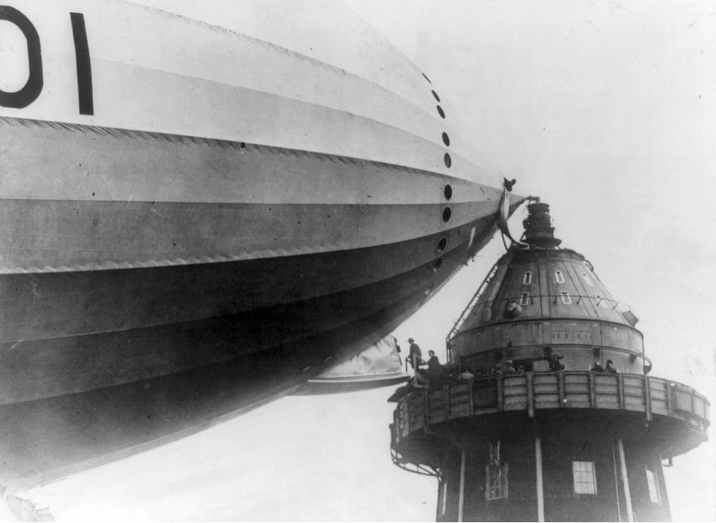 Loading passengers onto an airship from a mooring mast in the early 1930’s