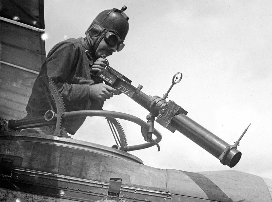 A soldier poses with a Hythe Mk III Gun Camera during training activities at Ellington Field, Houston, Texas in April of 1918.