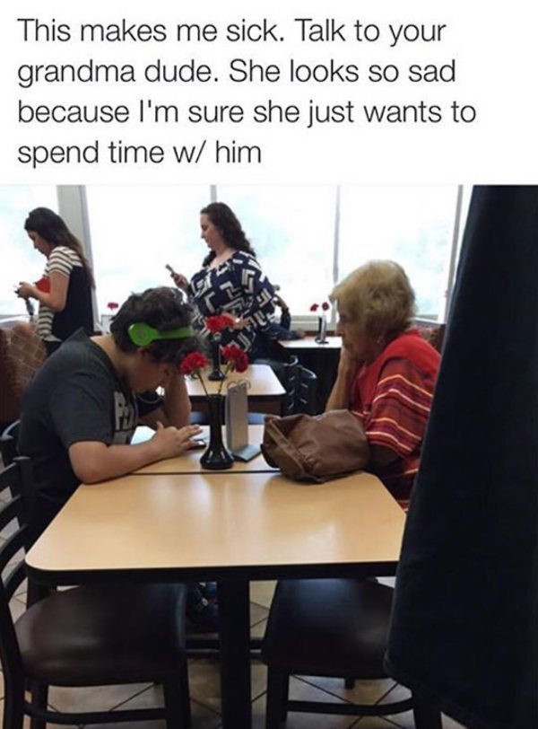 kid on phone at restaurant - This makes me sick. Talk to your grandma dude. She looks so sad because I'm sure she just wants to spend time w him 20