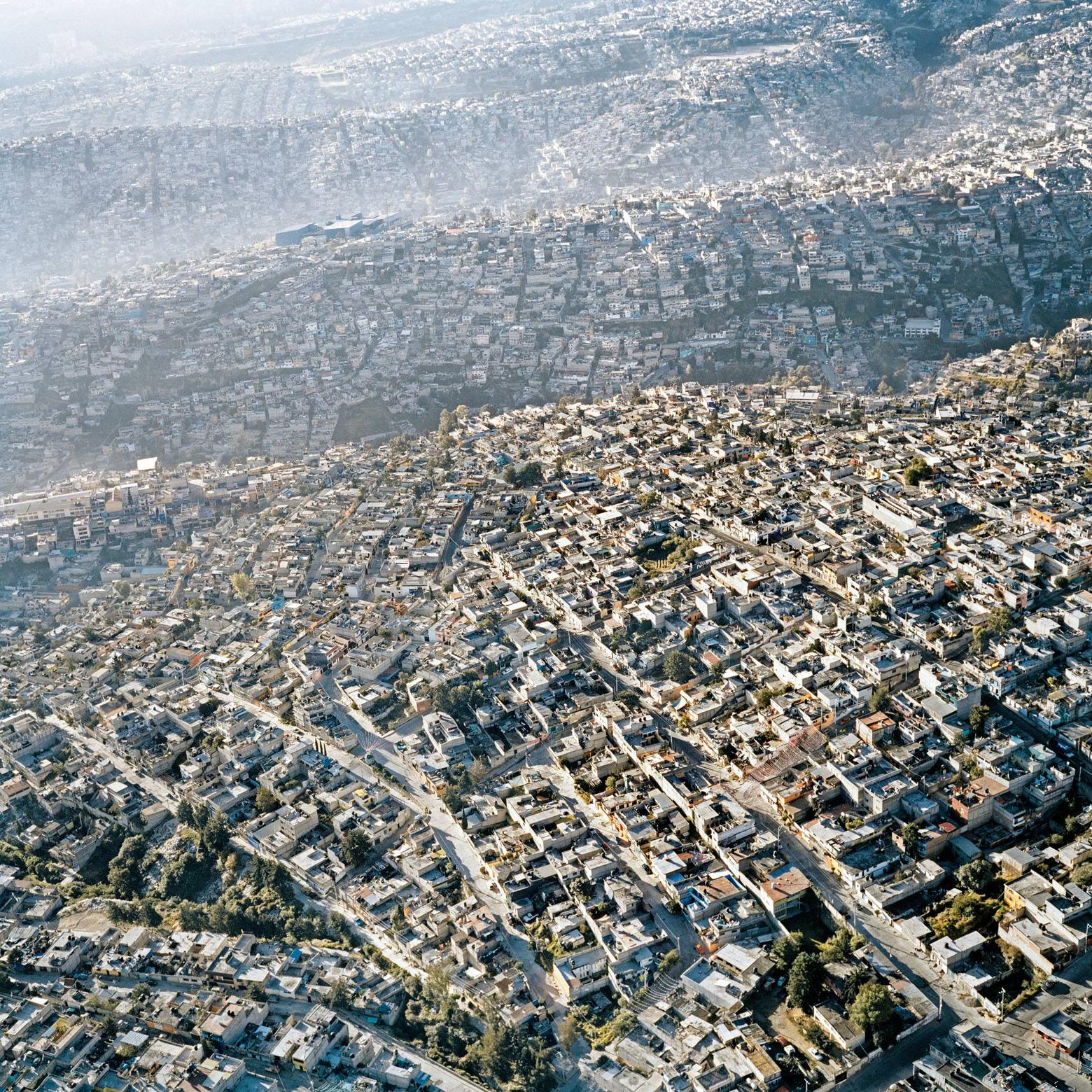 Mexico City as urban concrete jungle on rolling hills