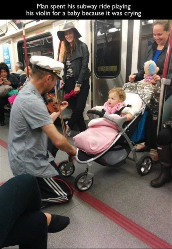 kindness faith in humanity restored - Man spent his subway ride playing his violin for a baby because it was crying