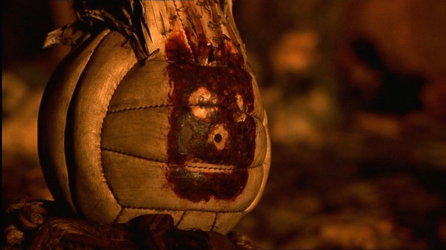 Wilson, Cast Away (2000)
Robin L. Miller, property master: “Wilson was in the script because, as I remember, [writer William Broyles Jr.] was down in Mexico and literally found a volleyball on the beach. Later we were told by psychologists that people, when they’re stranded and in moments of isolation, usually choose an inanimate object to talk to because they can’t handle being alone. The odd part of this was that the name ‘Wilson’ was in the script, and so I approached Wilson the company to make me volleyballs. Wilson wasn’t interested, at that point. Moviemaking had nothing to do with them. But I was very fortunate to find a woman there who, after I explained I was working with an Academy-Award-winning actor and an Academy-Award-winning director, the ball was called Wilson, for godsakes, and I needed blank ones, so I could make the face with Tom’s handprint. She got me 20 — only 20.
“I blew through 20 in a heartbeat. He went through all these incarnations, plus ones I could use for take after take after take. There were only five [hero props] used in the movie for up close shots.The aging on him changes over the course of the movie. His hair gets wrecked by the end. But we made them all last. I guarded them with my life. We were in Fiji, and then traveling to some island an hour and a half away from Fiji. The other nightmare was all those FedEx boxes — they fell apart in the humidity, so for all those takes, we were gluing them back together take after take. They were cardboard turning into soggy graham crackers. But the Wilsons were locked up. I practically took them to bed with me. They took a long time to fabricate, with the hair and the aging.
“When Tom made the original one, I put red tempera paint on his hand and he made the pattern on the ball, not on camera. He tried it and… it didn’t look great. So we did it again and again and again, and when we got one with enough room for the face, that became the template. We redid it on camera, and then we knew where we were headed because we came up with the concept three months earlier: how far his fingers needed to spread, what lines it needed to reach on the ball. Then the others were all hand-sewn, the hair was put in, and a scenic painter made five perfect matches, and then we had others for second, third, and fourth unit. Wilson had to be on every raft, and I wasn’t going to give them my best ones!
“The challenge was they all had to match. Towards the very end, the one that sinks, it’s so sad and so dirty. The hair is messed up. The one that ultimately sank, there were two (and remember, I only had five), but the effects department had to weight them to get pulled underwater. That was special — it aged the most. I don’t think we did many takes of that scene. It was the end of his journey.”