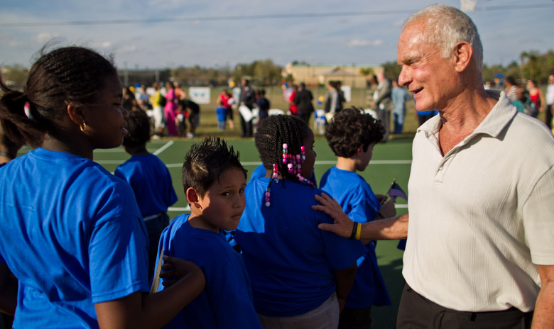 A self-made millionaire Harris Rosen adopted a Florida neighborhood called Tangelo Park, cut the crime rate in half, and increased the high school graudation rate from 25% to 100% by giving everyone free daycare and all high school graduates scholarships.

Rosen, 73, began his philanthropic efforts by paying for day care for parents in Tangelo Park, a community of about 3,000 people. When those children reached high school, he created a scholarship program in which he offered to pay free tuition to Florida state colleges for any students in the neighborhood.
In the two decades since starting the programs, Rosen has donated nearly $10 million, and the results have been remarkable. The high school graduation rate is now nearly 100 percent, and some property values have quadrupled. The crime rate has been cut in half, according to a study by the University of Central Florida.