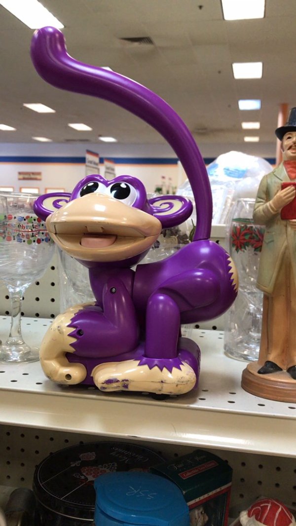 Purple monkey toy at thrift shop