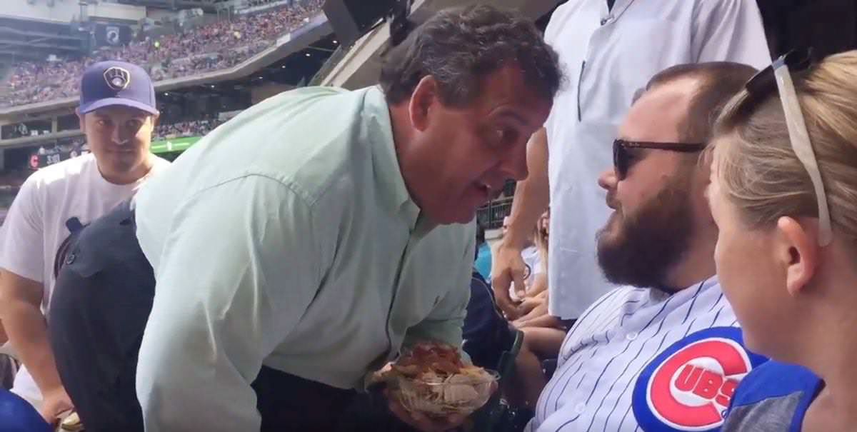 Chris Christie with nachos in his hands confronts fan who heckled at Milwaukee Brewers game