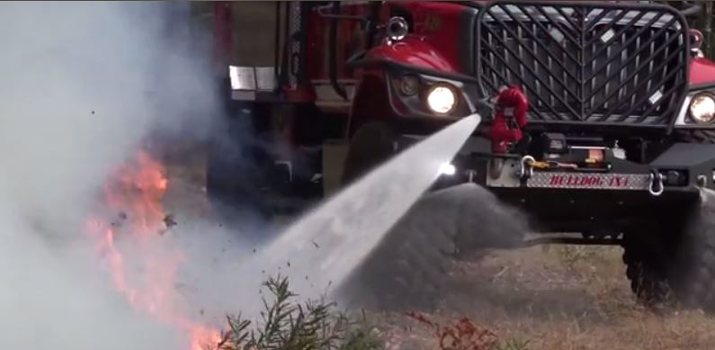 This firetruck is made for brush fires, and has nozzles that spray downward to protect the tires.