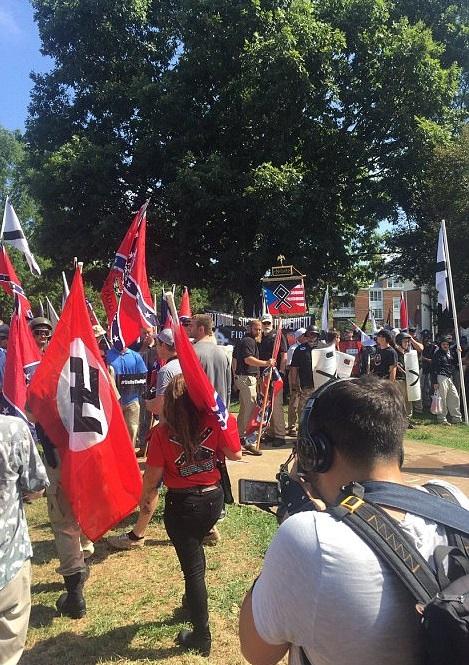 How can someone call themselves an American patriot while holding a Nazi flag?