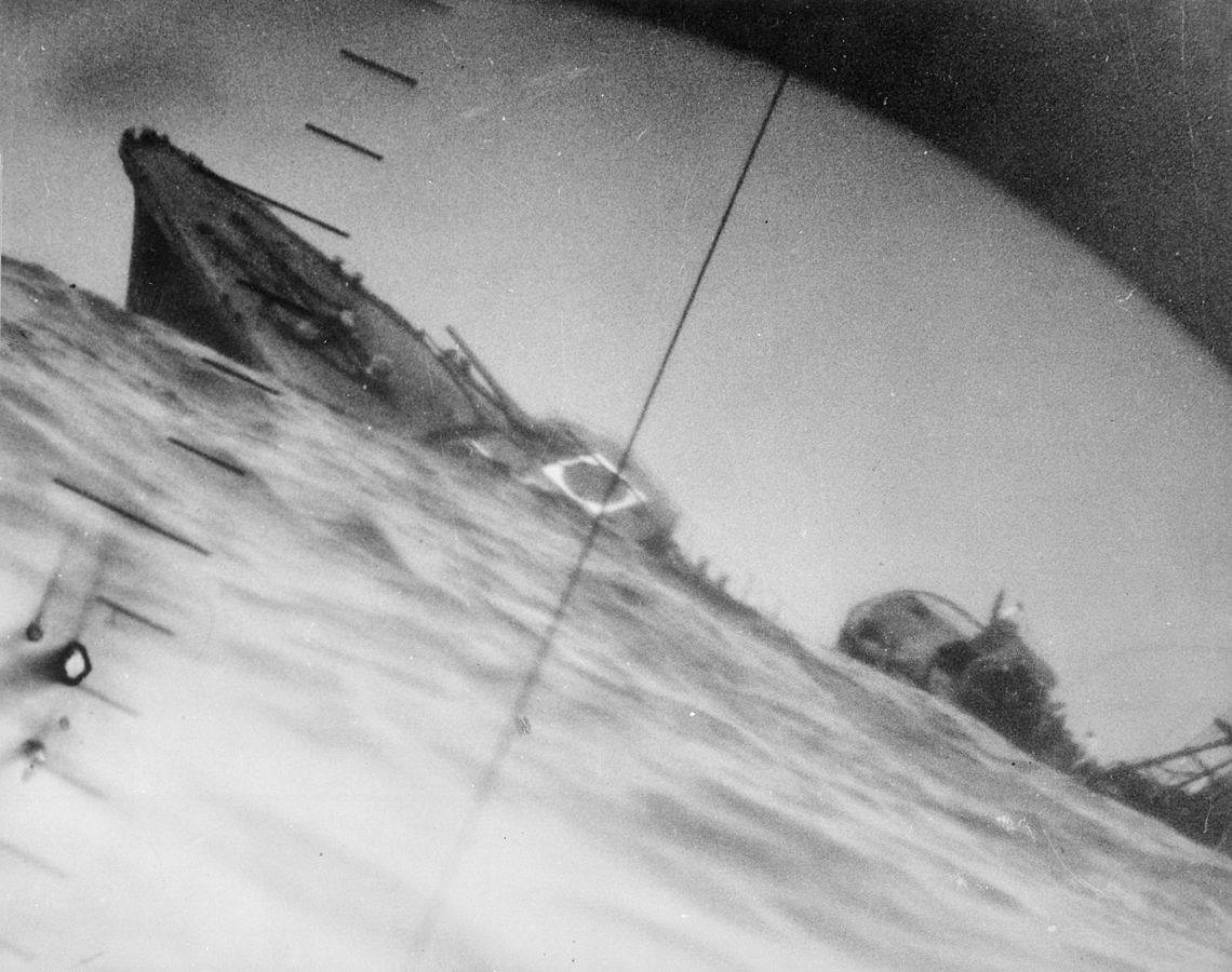 The torpedoed Japanese destroyer Yamakaze, as seen through the periscope of an American submarine, USS Nautilus, in June 1942