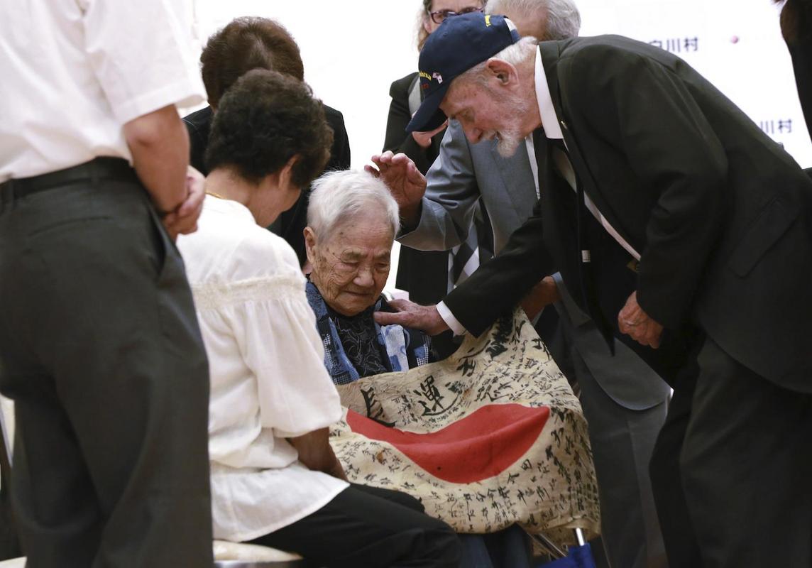 US Marine returns a flag he took from a fallen Japanese soldier during WWII to the soldier’s family. They had never received any of his remains or belongings until that moment.

Marvin Strombo, who had taken the calligraphy-covered Japanese flag from a dead soldier at a World War II island battlefield 73 years ago, returned it Tuesday to the family of Sadao Yasue. They had never gotten his body or — until that moment — anything else of his.
Yasue and Tatsuya’s sister Sayoko Furuta, 93, sitting in her wheelchair, covered her face with both hands and wept silently as Tatsuya placed the flag on her lap. Strombo reached out and gently rubbed her shoulder.
‘‘I was so happy that I returned the flag,’’ Strombo said. ‘‘I can see how much the flag meant to her. That almost made me cry … It meant everything in the world to her.’’
The flag’s white background is filled with signatures of 180 friends and neighbors in this tea-growing mountain village of Higashishirakawa, wishing Yasue’s safe return. The signatures helped Strombo find its rightful owners.
The smell of the flag immediately brought back childhood memories. ‘‘It smelled like my good old big brother, and it smelled like our mother’s home cooking we ate together,’’ Tatsuya Yasue said. ‘‘The flag will be our treasure.’’