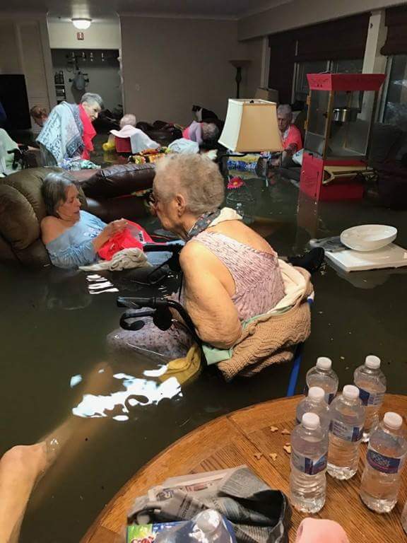 Elderly waiting to be rescued from flood waters in Dickinson, Texas