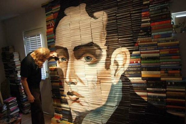 Books aligned to make a portrait on the bookcase.