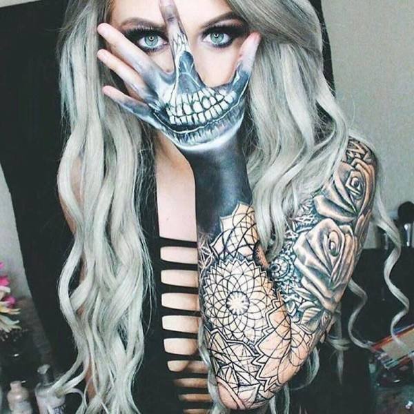 Girl with tattoo on her hand that works well when she uses it over her mouth.