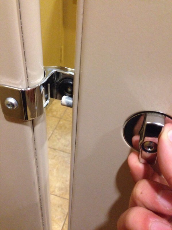 Frustrating bathroom stall lock that doesn't reach it's destination or goal.