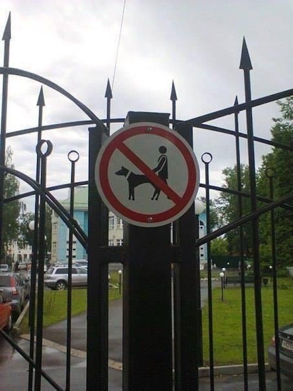 Sign forbidding certain acts on dogs.