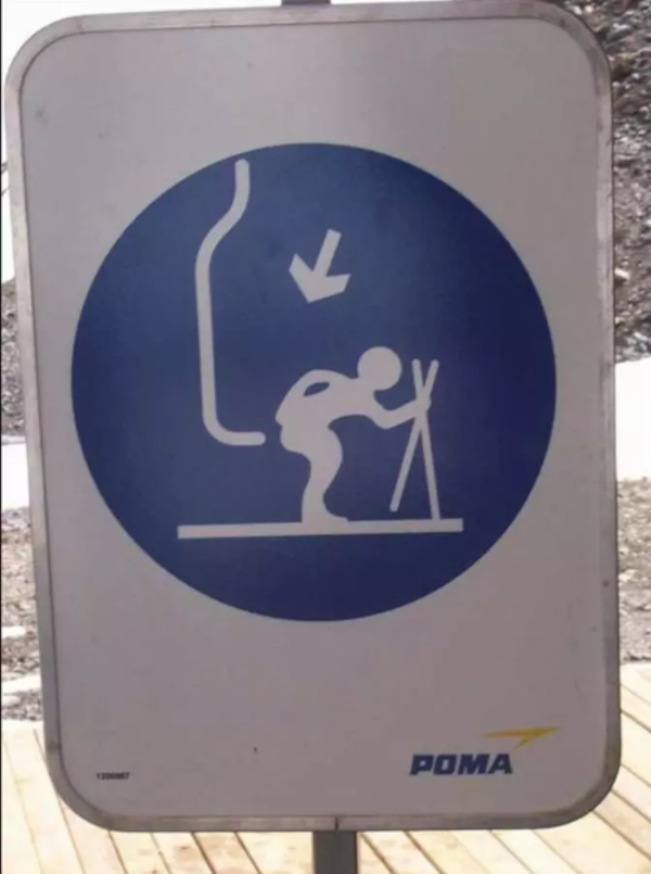 ski lift sign that is a bit wonky