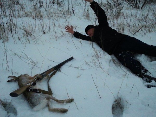 Russian man poses with his dead rabbit as if the hare has taken him hostage